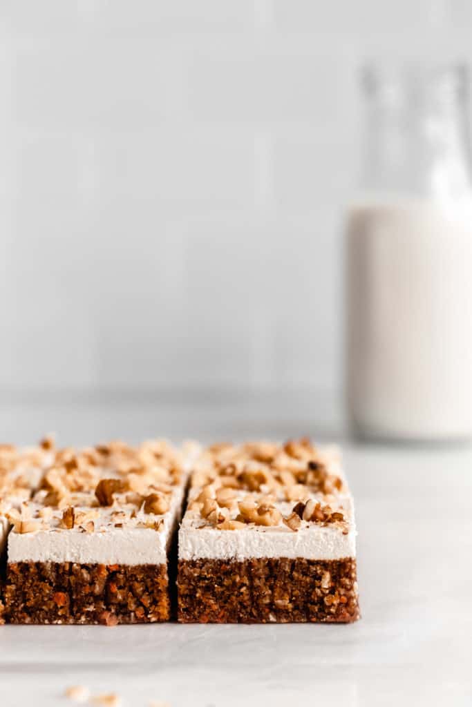 raw carrot cake topped with walnuts
