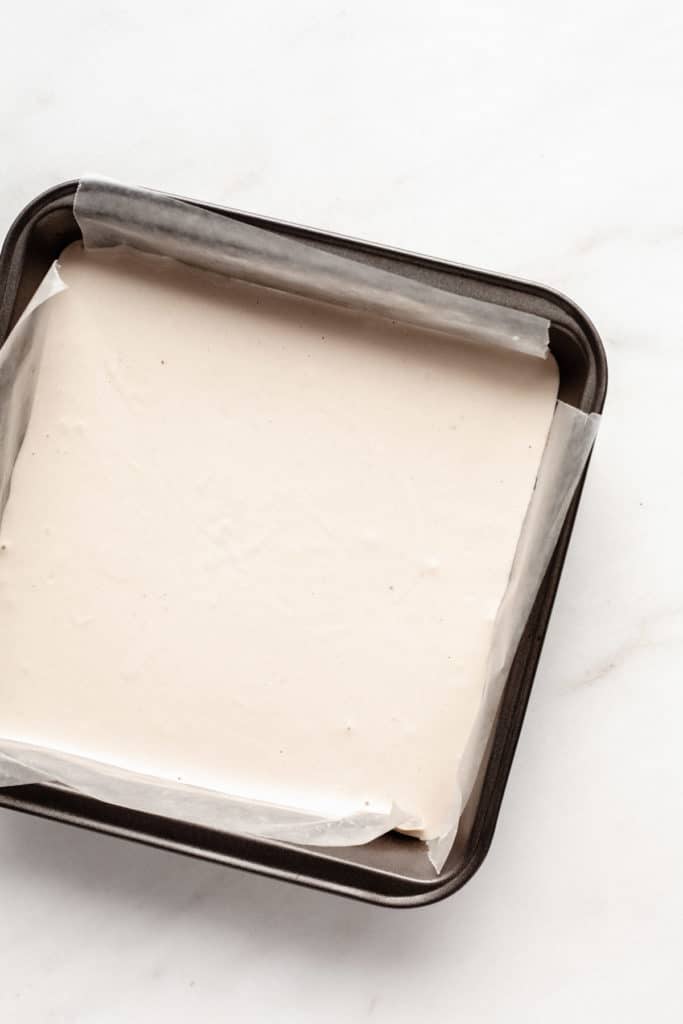 raw cashew cream in an 8x8 inch pan