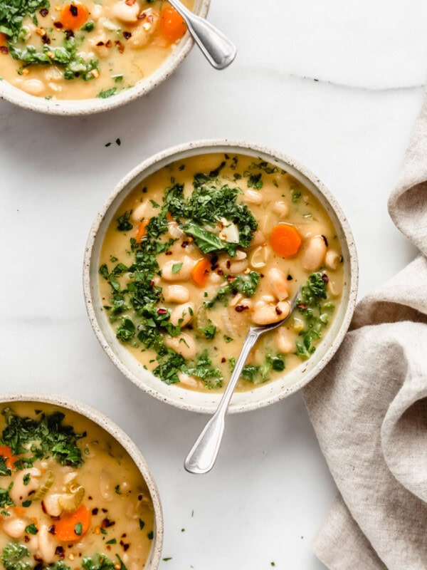 bowl of white bean soup with a spoon in it