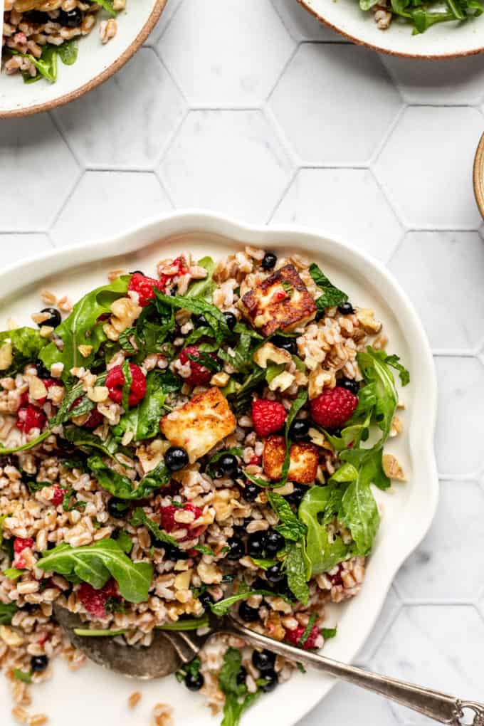 a plate of halloumi and farro salad