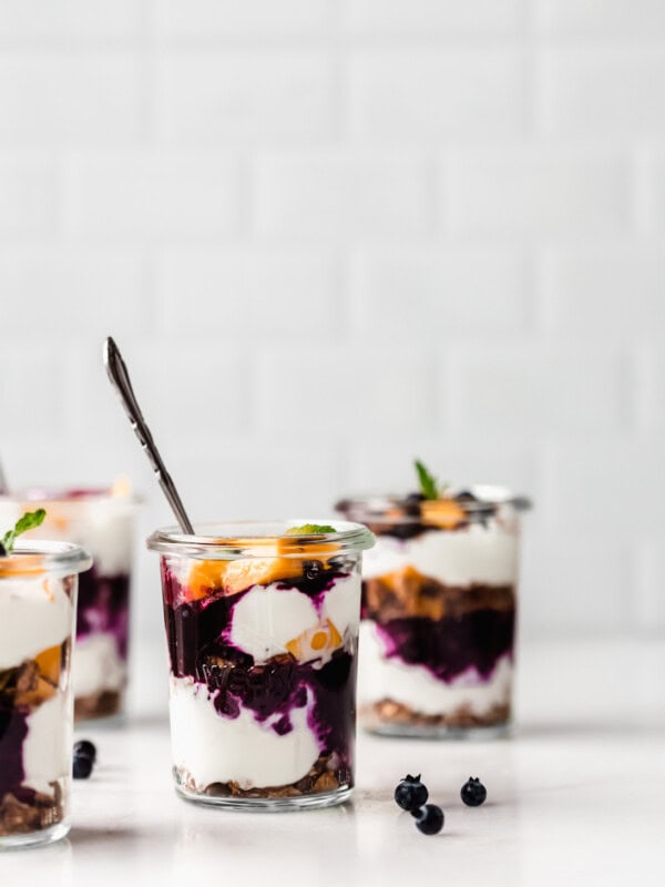 Jars of yogurt and granola parfaits
