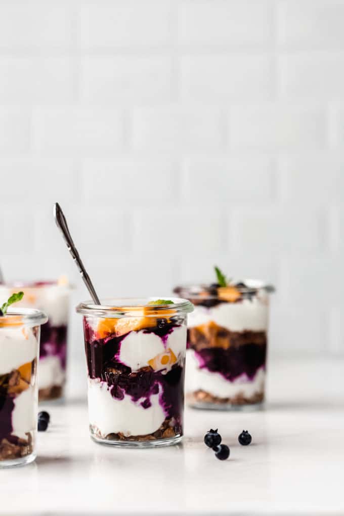 Jars of yogurt and granola parfaits