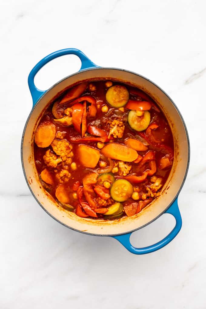 A blue pot filled with vegetable tagine
