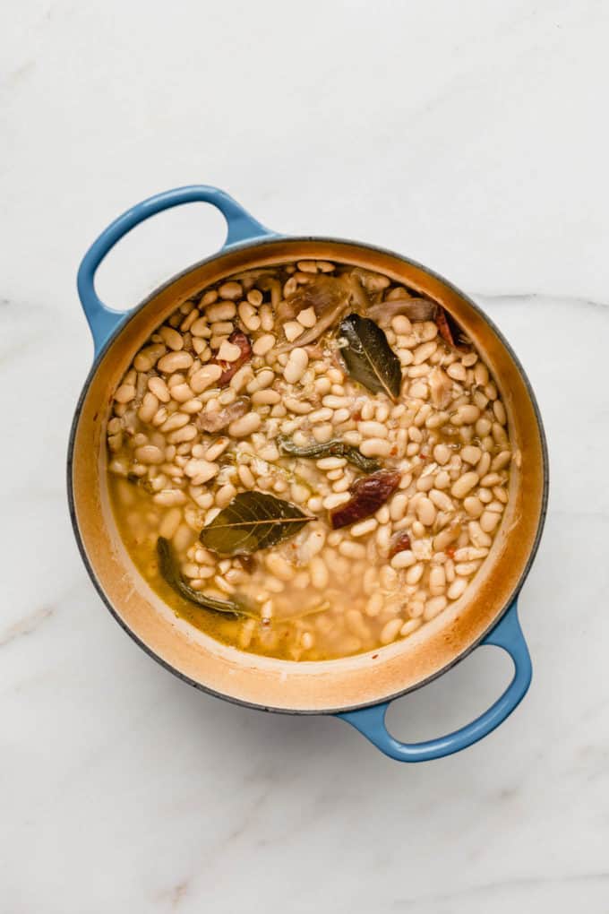 A blue pot filled with beans in borth