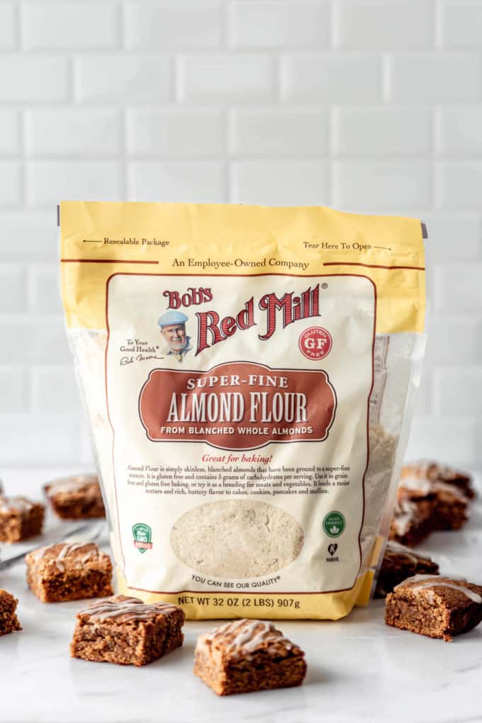 a bag of Bob's Red Mill Almond Flour on a marble counter with blondies around it