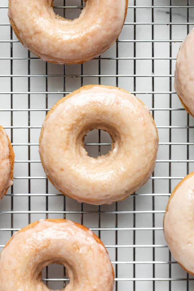 maple donuts on a metal cooling rack