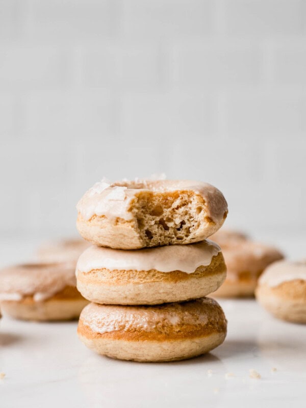 a stack of three maple donuts