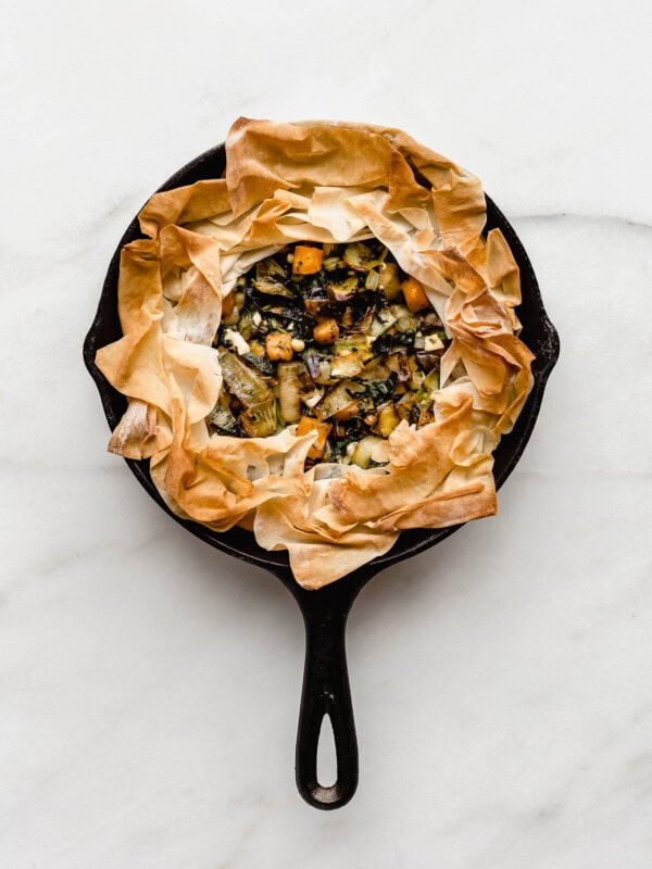 A veggie skillet phyllo pie baked in a cast iron skillet