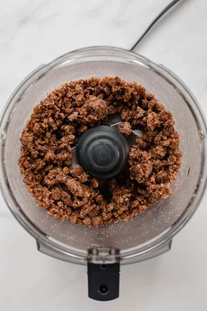 a food processor with blended dates in it