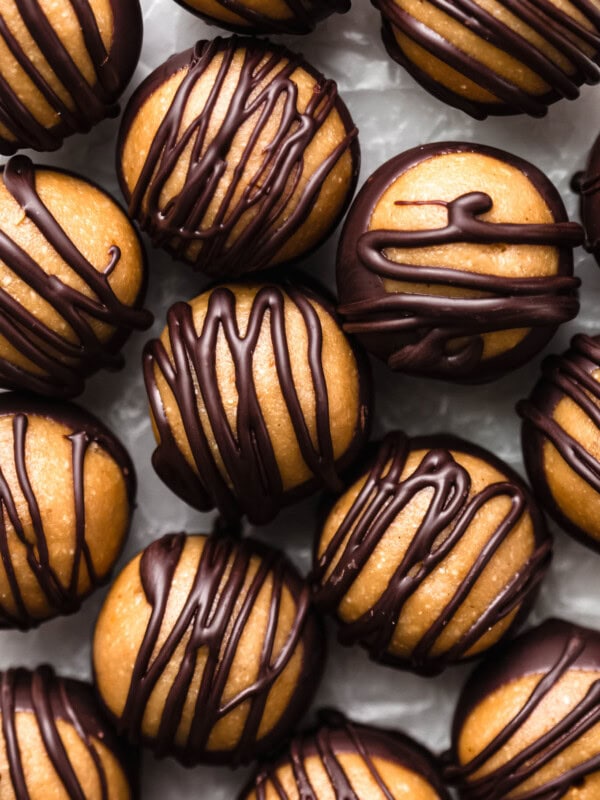 peanut butter balls drizzled with dark chocolate