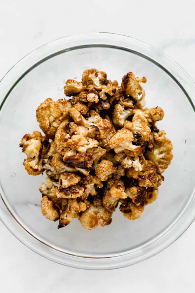 kung pao cauliflower in a clear mixing bowl
