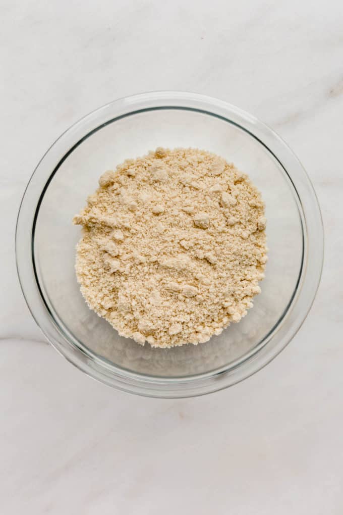 A clear mixing bowl filled with almond flour