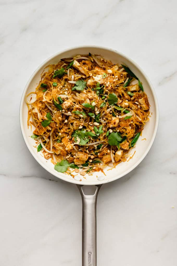 A white pan with spaghetti squash pad Thai in it