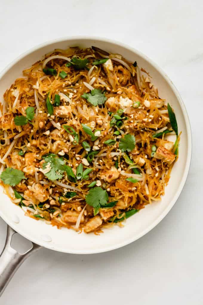 Spaghetti squash and vegetables in a white pan
