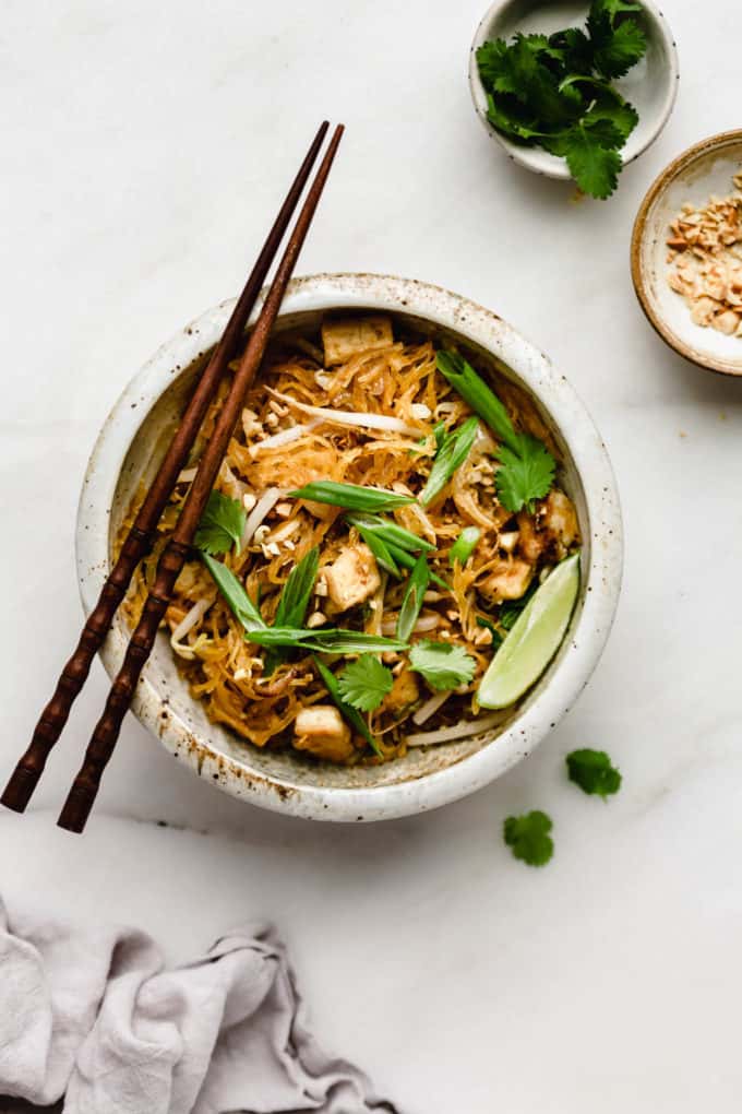 Spaghetti squash pad Thai in a white ceramic bowl