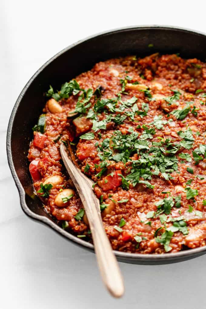 A close up of vegan shakshuka topped with parsley