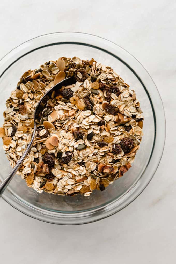 A clear mixing bowl filled with toasted muesli