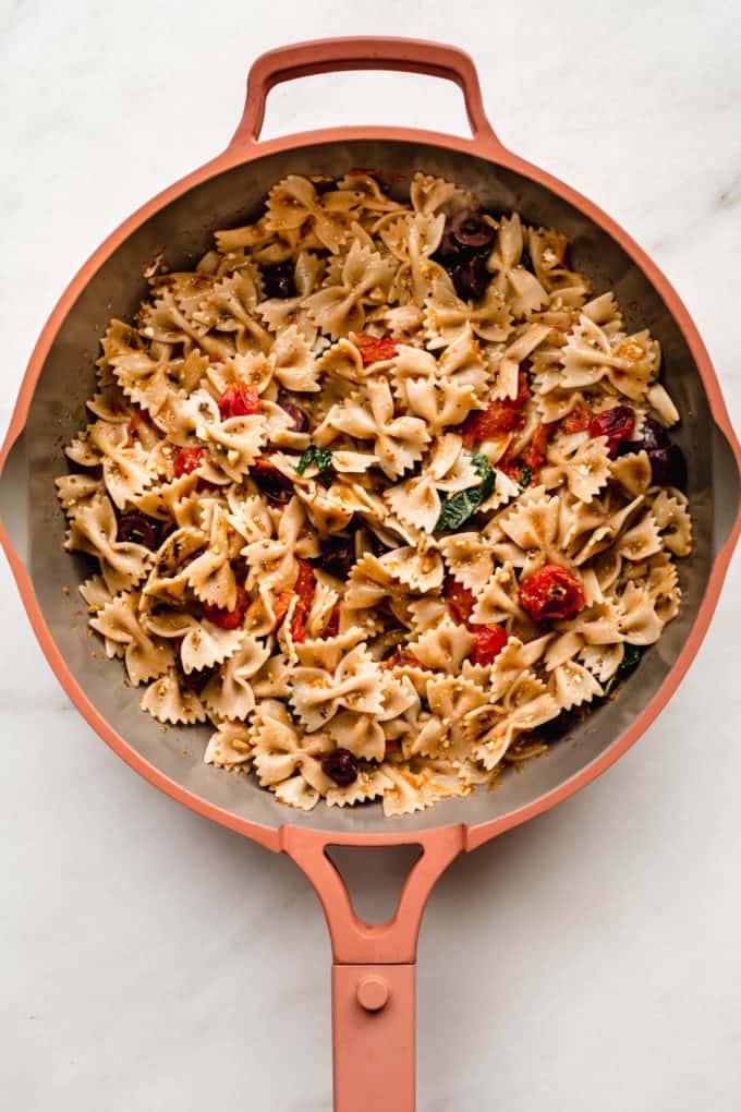 mediterranean farfalle pasta in a pink pan
