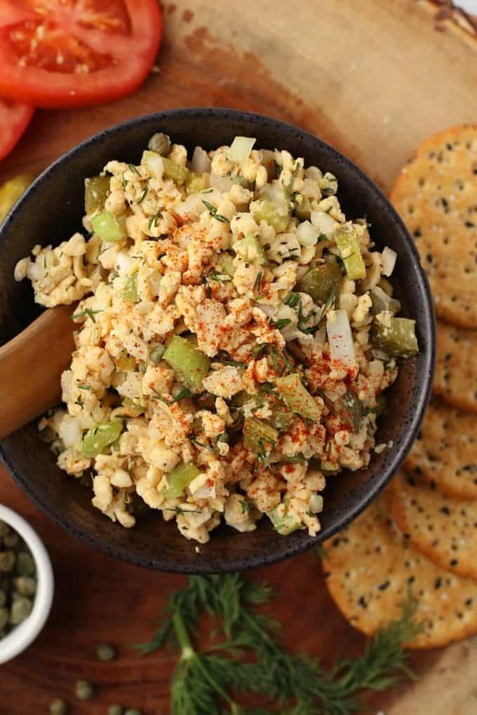 A black bowl with vegan tuna salad in it