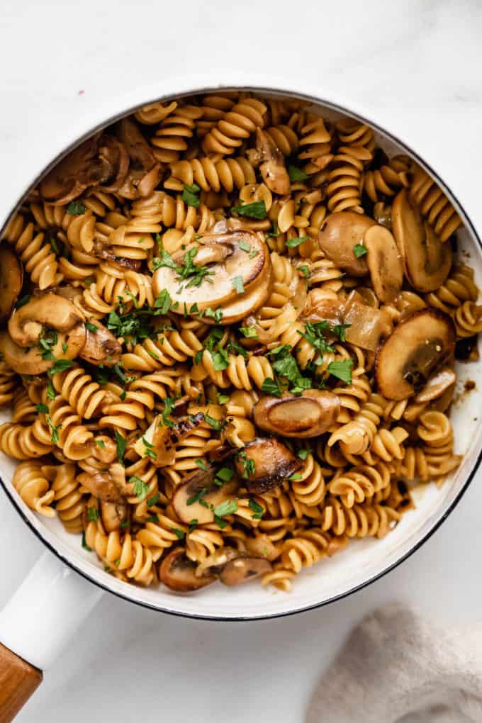 A close up of vegan mushroom stroganoff in a white pot