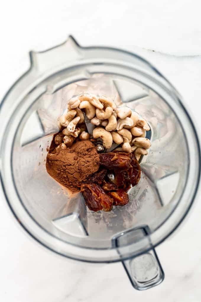 cashews, dates and cocoa powder in a blender