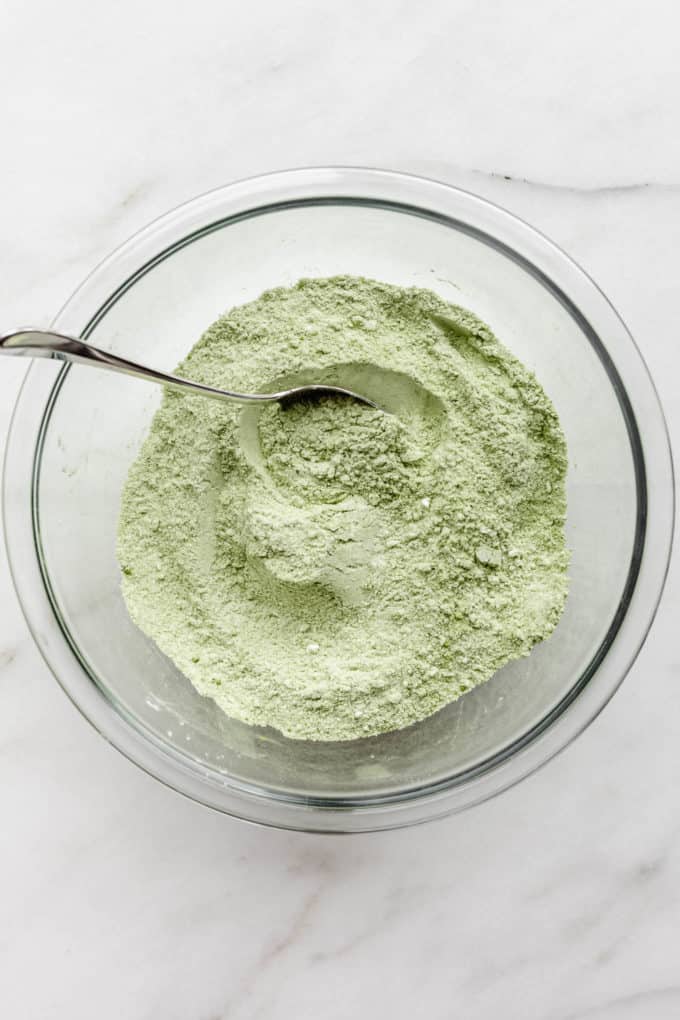 a bowl of flour and matcha powder