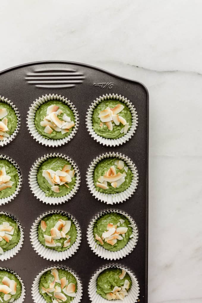 unbaked matcha muffins in a baking pan