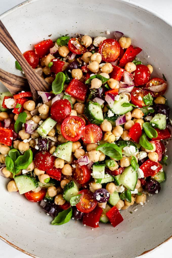 Mediterranean Chickpea Salad tossed in a bowl