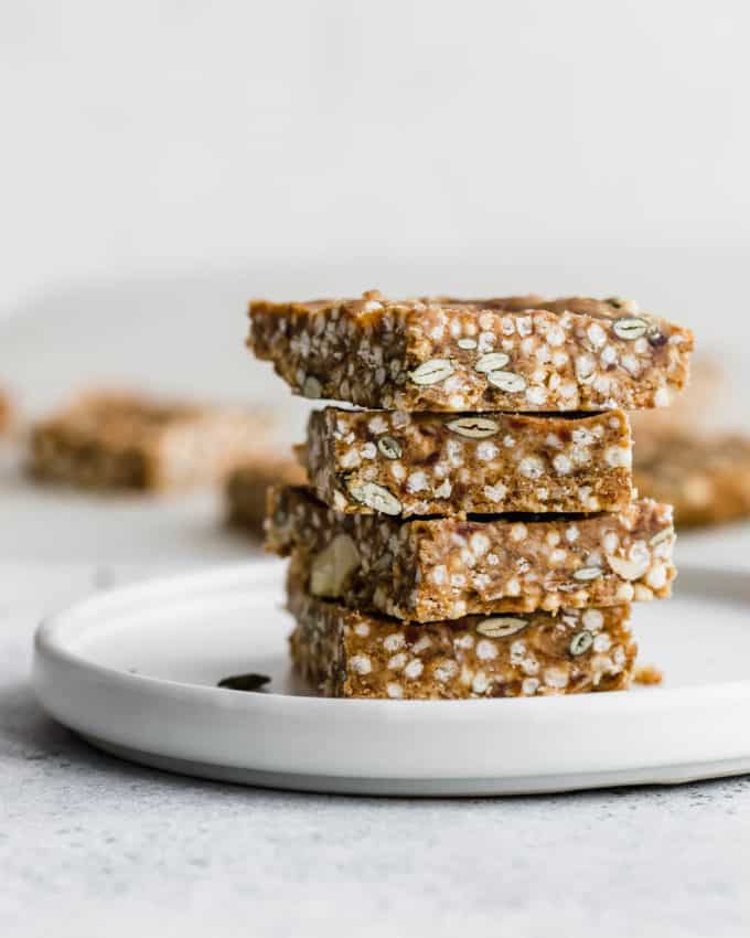 puffed quinoa and nut bars on a white plate