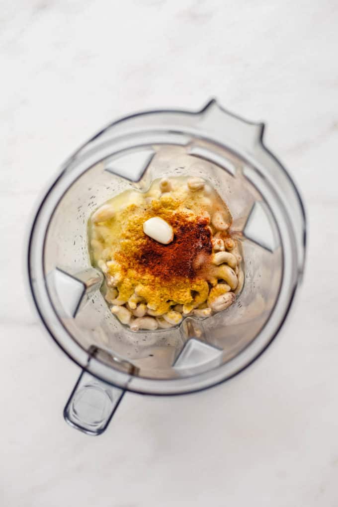 raw cashews, nutritional yeast, garlic and spices in a blender