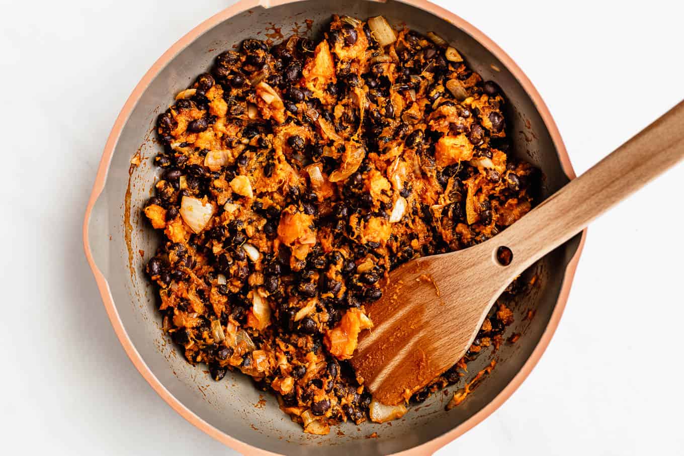 a pan with black beans and sweet potato in it