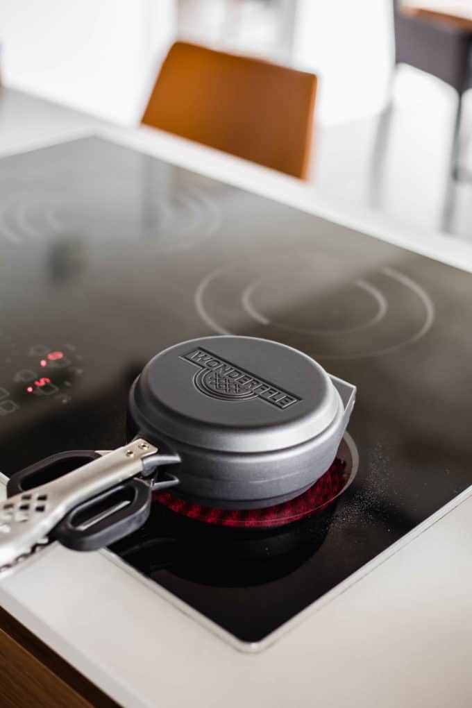a waffle iron on the stove