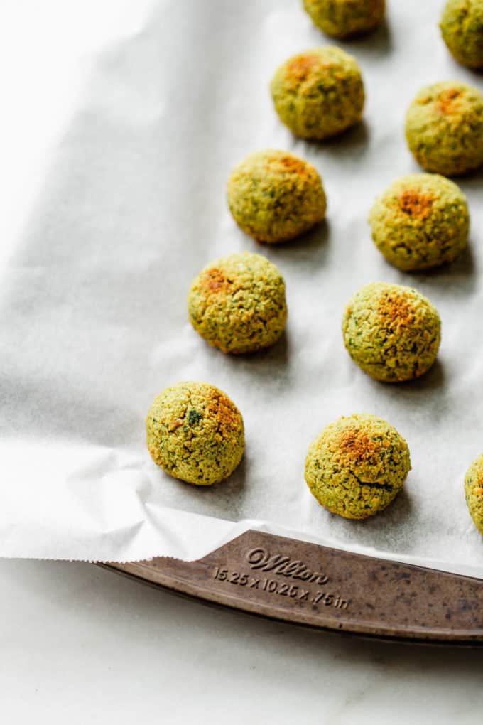 baked falafel on a baking sheet