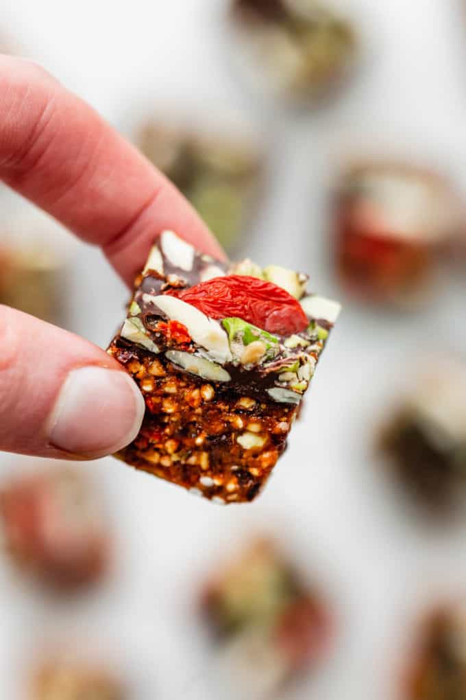 a hand holding a superfood energy bite