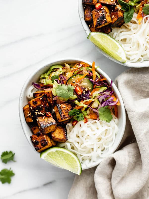 a Vietnamese noodle bowl with lemongrass tofu and a napkin on the side