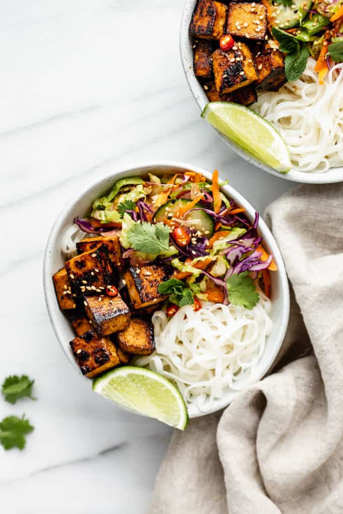 a Vietnamese noodle bowl with lemongrass tofu and a napkin on the side