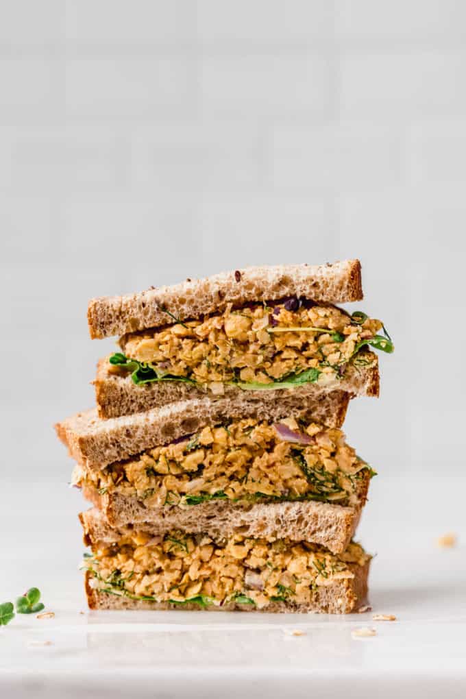 three halves of chickpea salad sandwich stacked