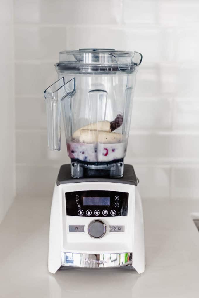 bananas, Acai, berries and almond milk in a blender