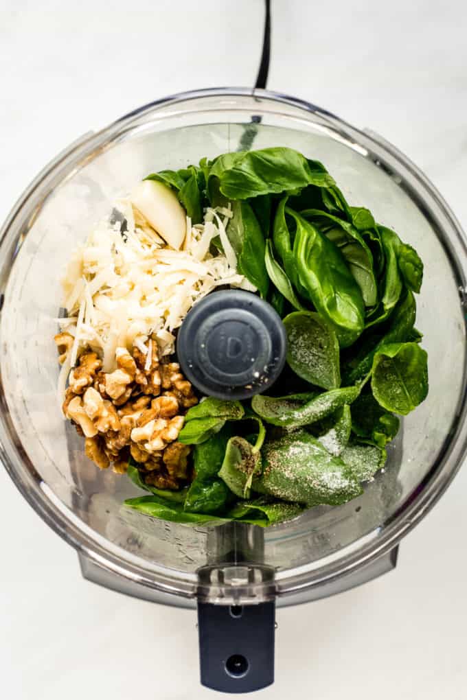 Basil walnuts, garlic and Parmesan cheese in a food processor
