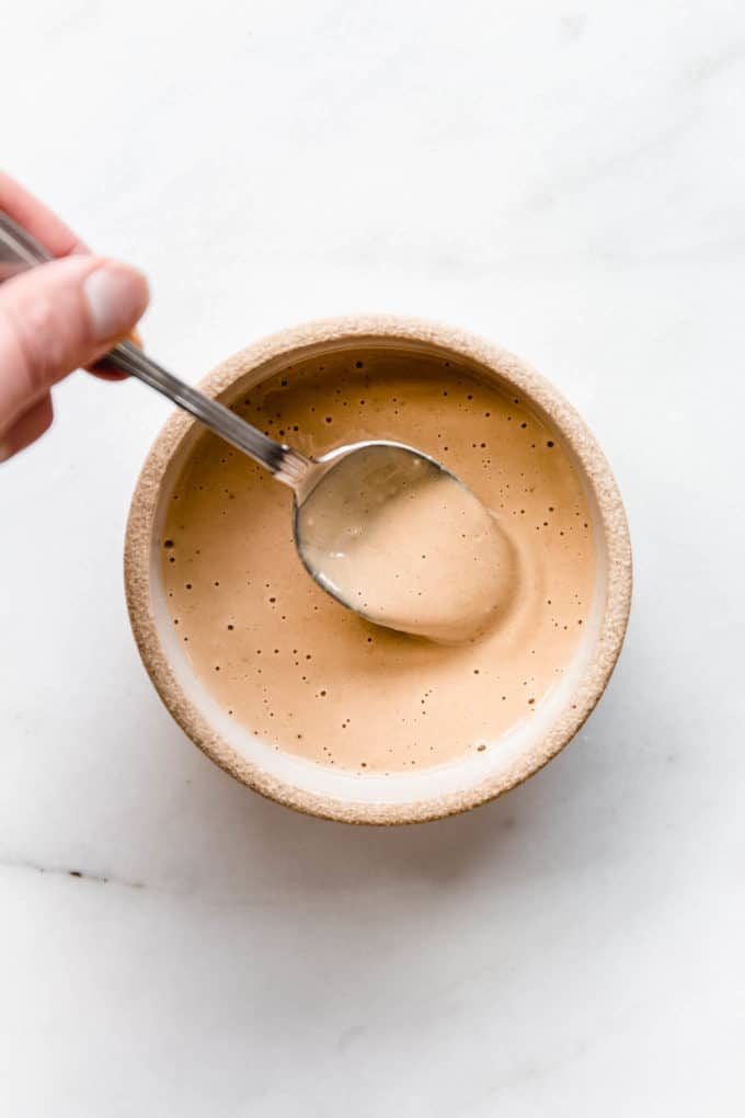 Thai sesame dressing in a small ceramic bowl