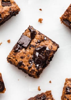 An almond butter blondie topped with chocolate chunks