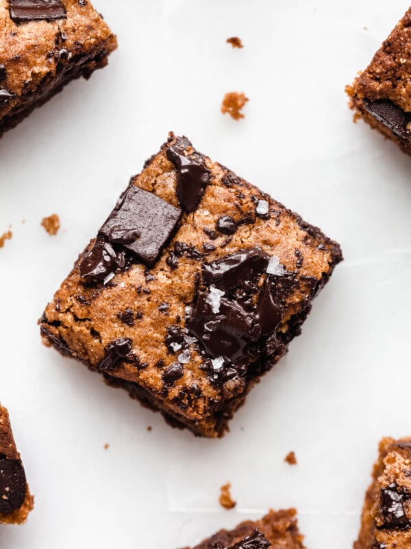 An almond butter blondie topped with chocolate chunks