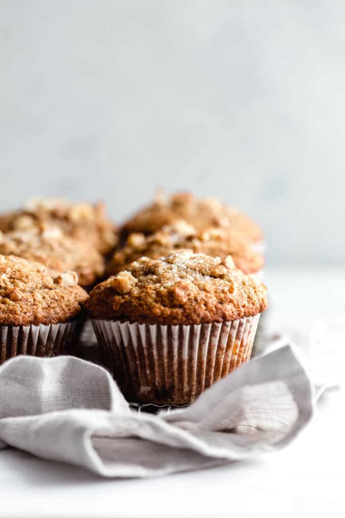 Banana nut muffins on a grey napkin