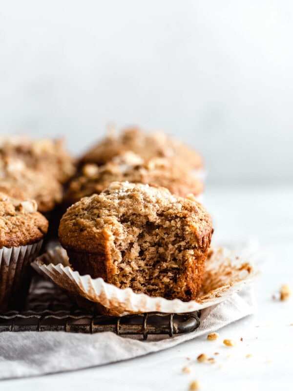 A banana nut muffin with a bite taken out of it