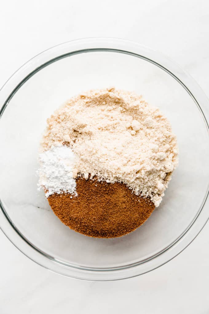 Almond flour and coconut sugar in a clear mixing bowl