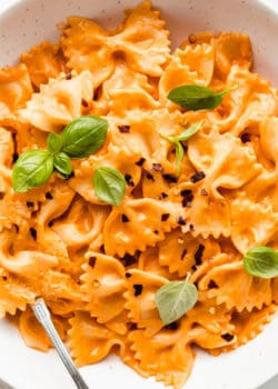 A bowl of farfalle pasta with vegan vodka sauce on it
