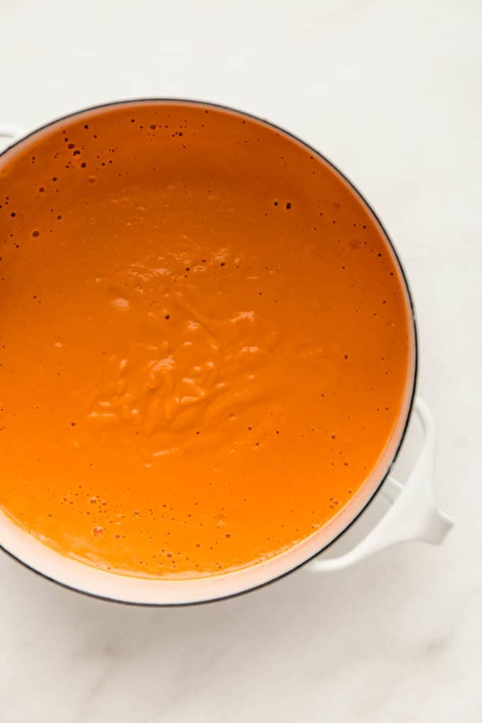 A white pot with vegan vodka sauce in it