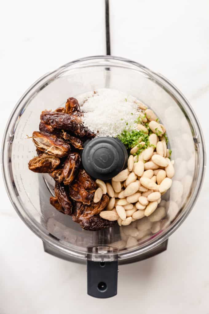 blanched almonds, dates, lime zest and coconut in a food processor