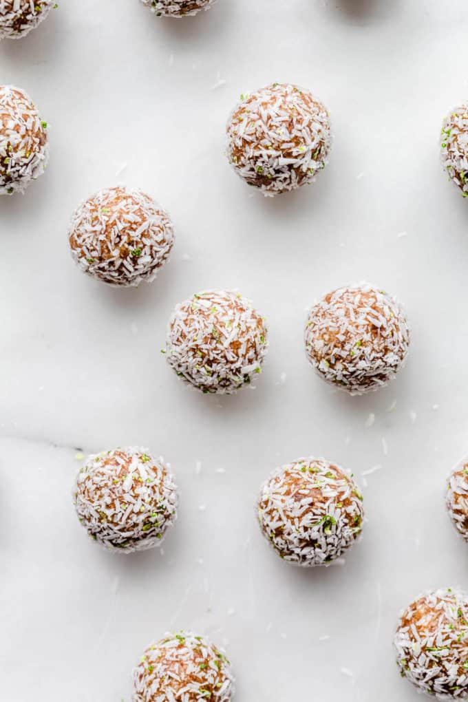 key lime pie energy balls topped with shredded coconut