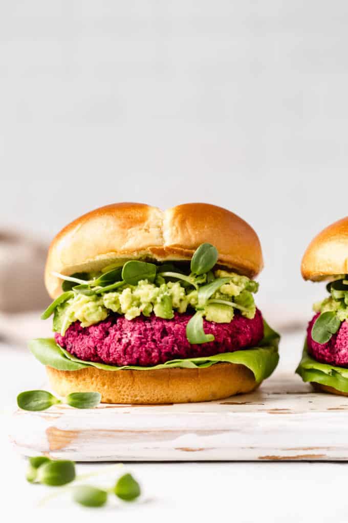 beet burgers on a white wooden serving board